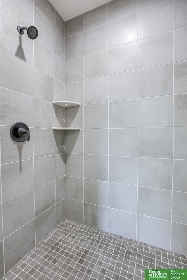 bathroom with a tile shower