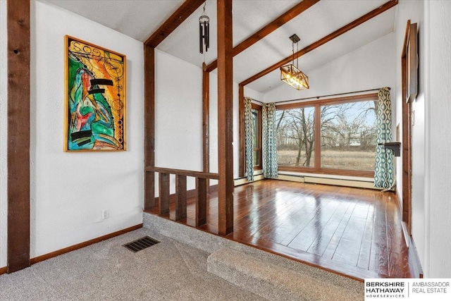 foyer entrance with baseboards, visible vents, lofted ceiling with beams, and baseboard heating