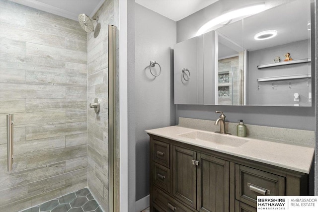 bathroom featuring a stall shower and vanity