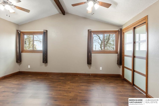 unfurnished room featuring vaulted ceiling with beams, ceiling fan, a textured ceiling, and wood finished floors