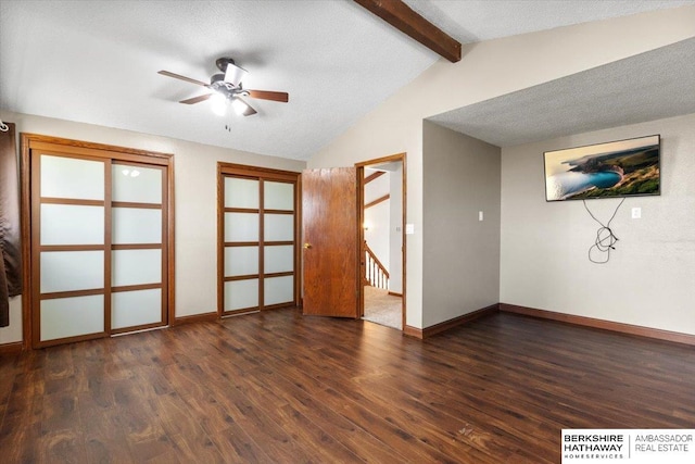 unfurnished room featuring vaulted ceiling with beams, ceiling fan, a textured ceiling, wood finished floors, and baseboards