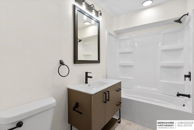 bathroom featuring bathing tub / shower combination, toilet, and vanity