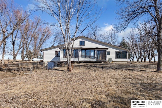 view of front of home featuring fence