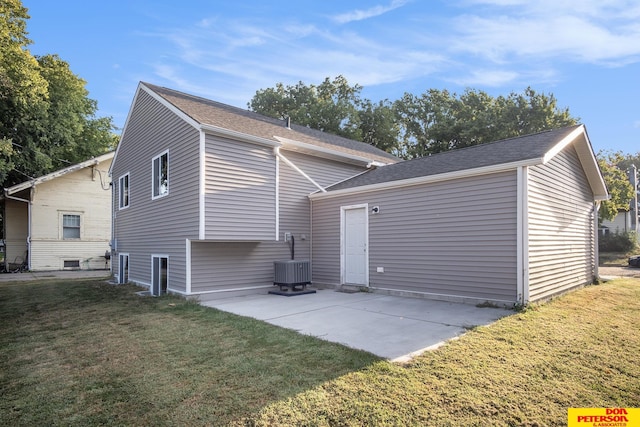 view of side of property with cooling unit, a patio, and a lawn