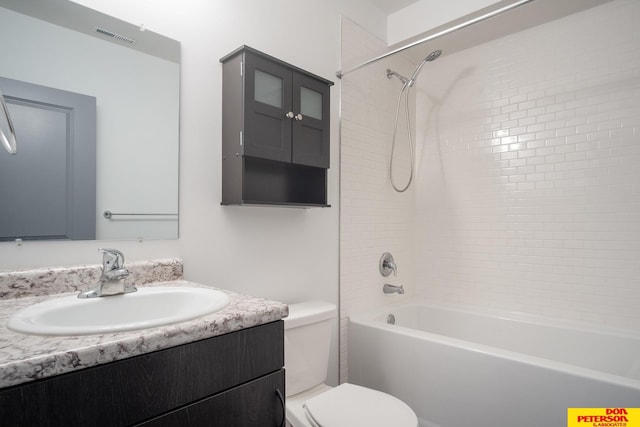 bathroom featuring washtub / shower combination, visible vents, vanity, and toilet