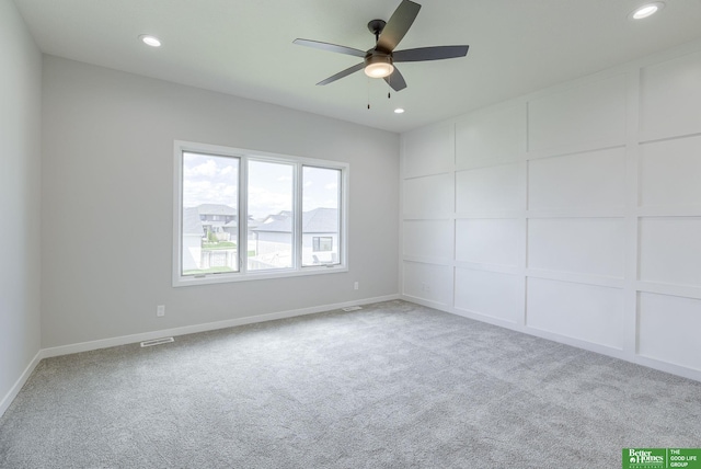 carpeted empty room with baseboards, visible vents, a ceiling fan, and recessed lighting