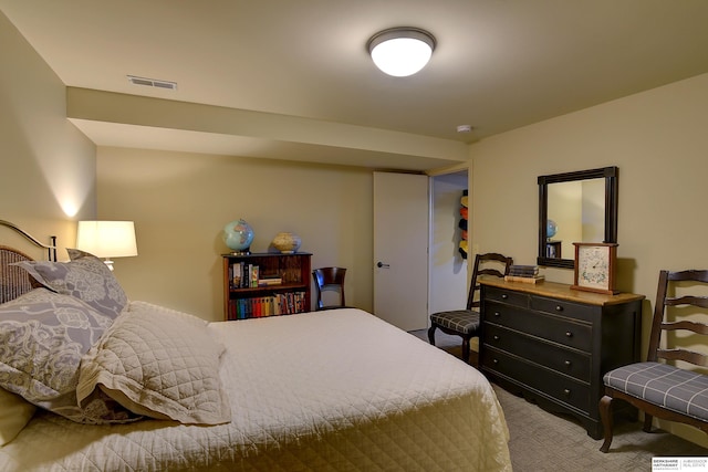 carpeted bedroom with visible vents