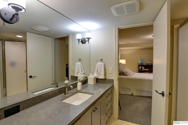 ensuite bathroom featuring visible vents, vanity, and ensuite bath