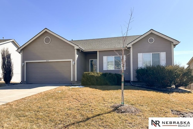 single story home featuring a garage, driveway, and a front lawn