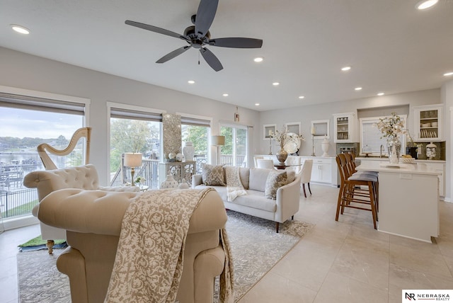 living area with light tile patterned floors and recessed lighting