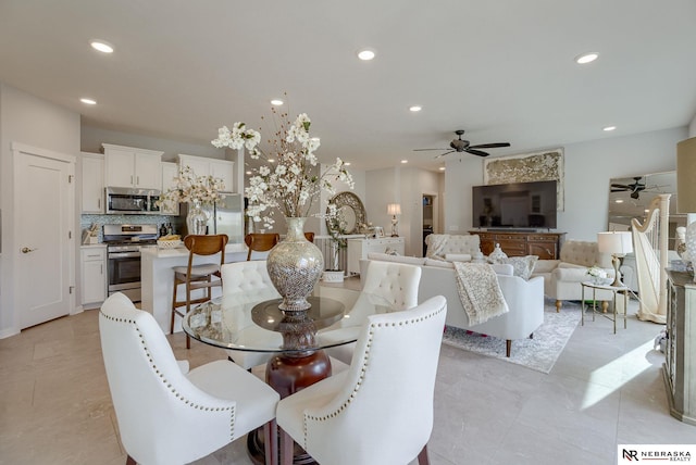 dining area with a ceiling fan and recessed lighting