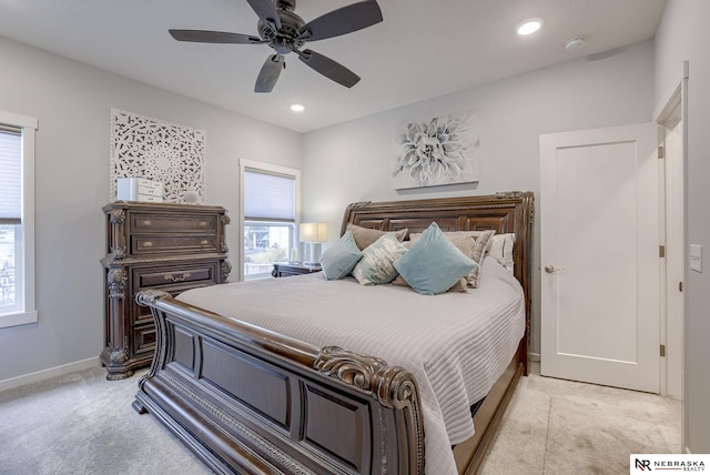 bedroom with light carpet, baseboards, a ceiling fan, and recessed lighting