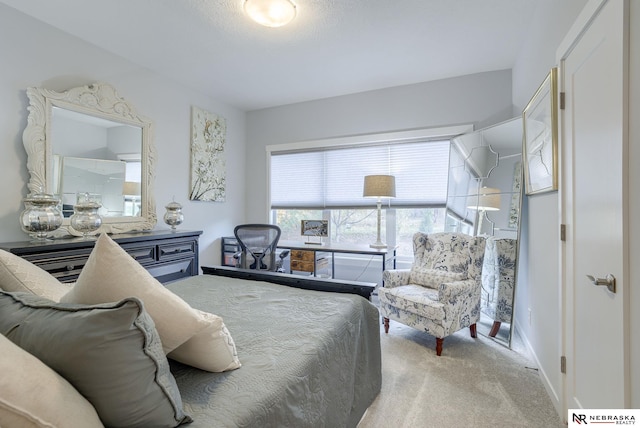 bedroom featuring light carpet