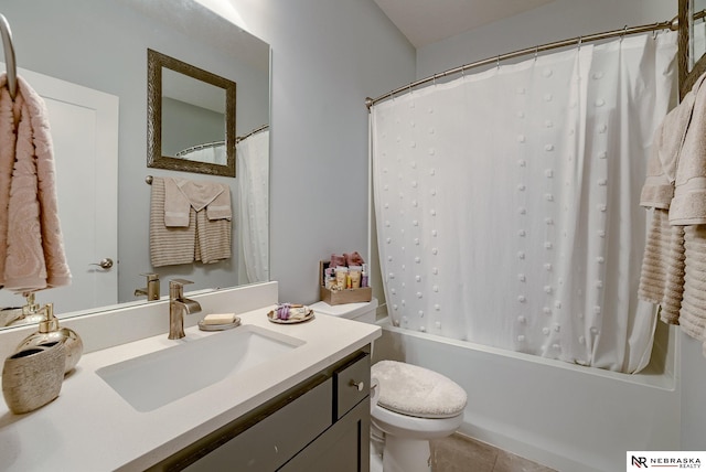 bathroom with toilet, tile patterned floors, shower / tub combo with curtain, and vanity