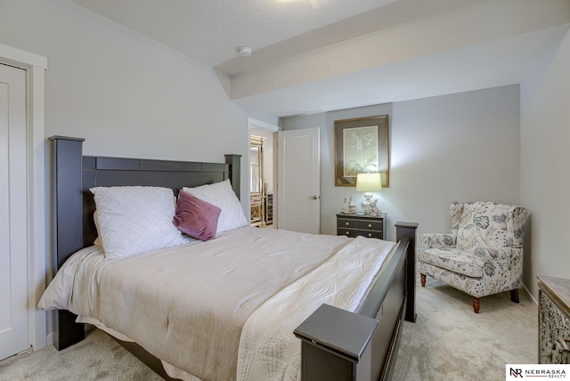 bedroom featuring light carpet