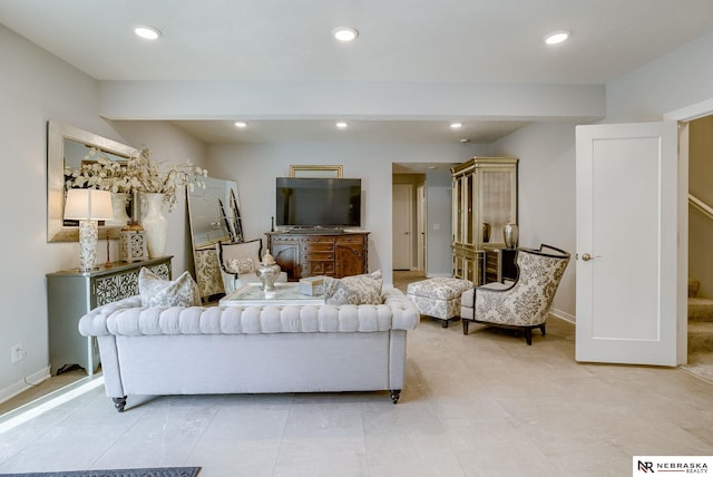 living room with recessed lighting and baseboards