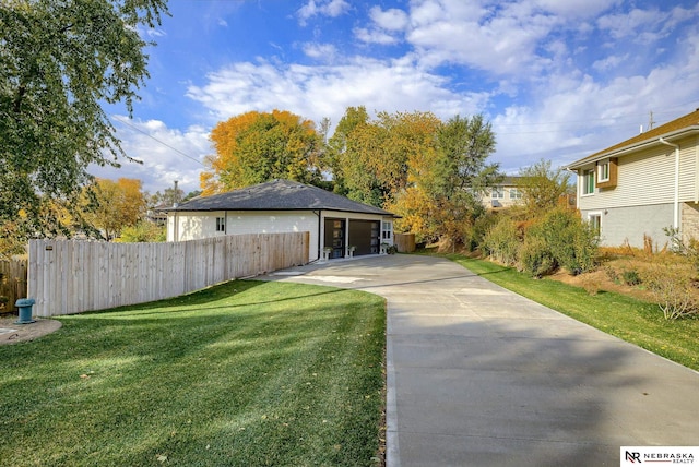 exterior space featuring a garage and fence