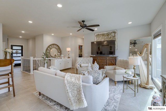 living area with ceiling fan and recessed lighting