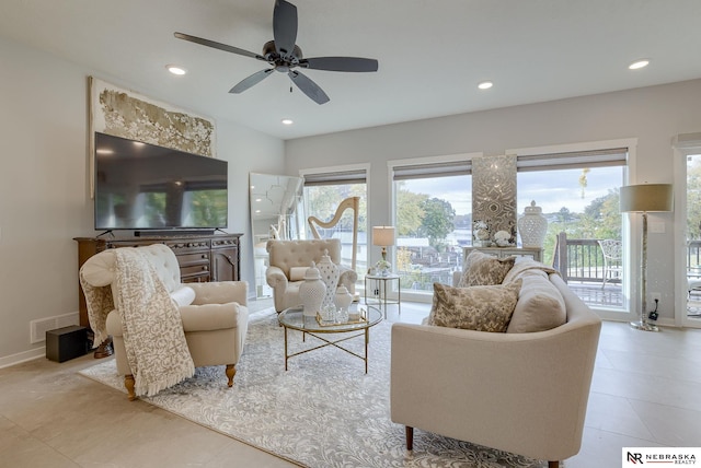 living room featuring recessed lighting, visible vents, baseboards, and light tile patterned floors