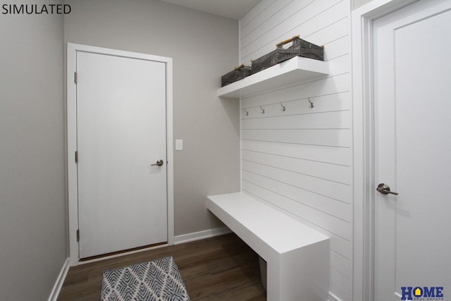 mudroom featuring dark wood-style flooring and baseboards