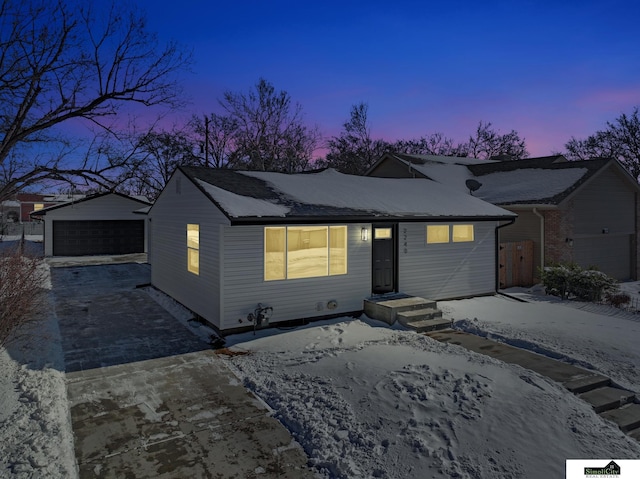 view of front of property featuring an outbuilding and a detached garage