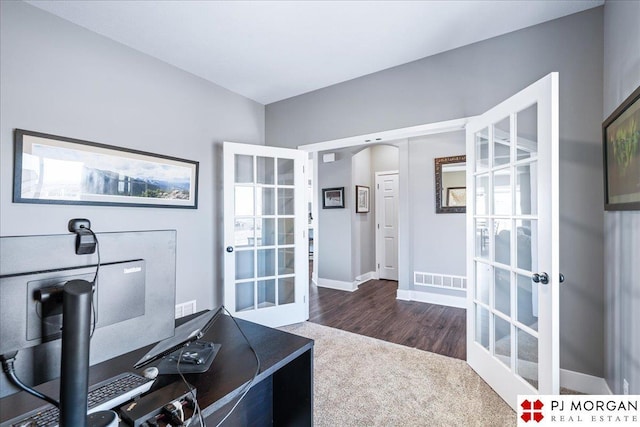 office featuring french doors, visible vents, baseboards, and wood finished floors