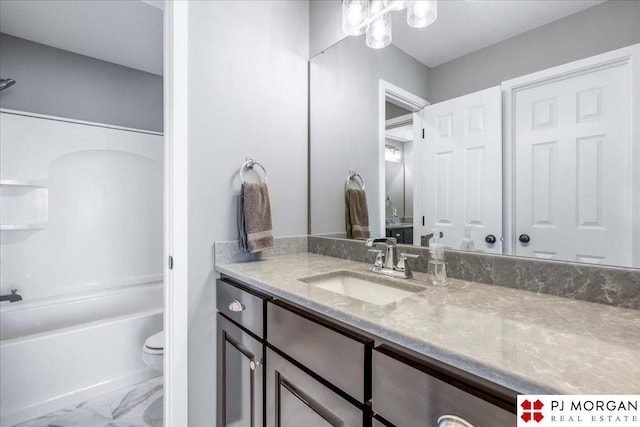 bathroom with marble finish floor, vanity, toilet, and bathing tub / shower combination