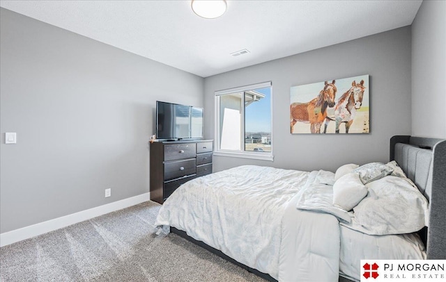 bedroom featuring carpet, visible vents, and baseboards