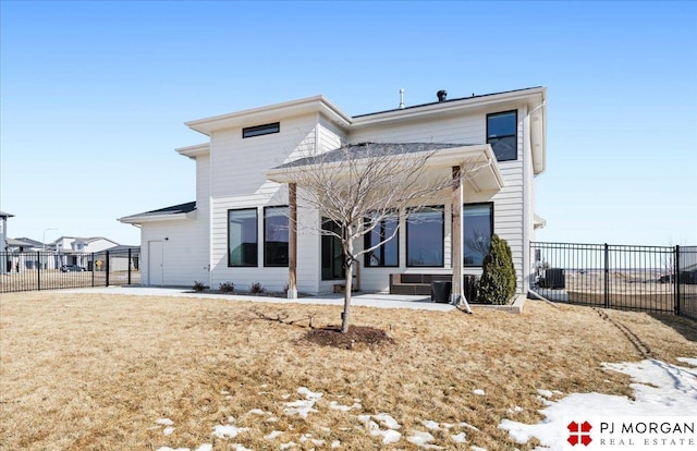 view of front of home featuring a patio area and fence