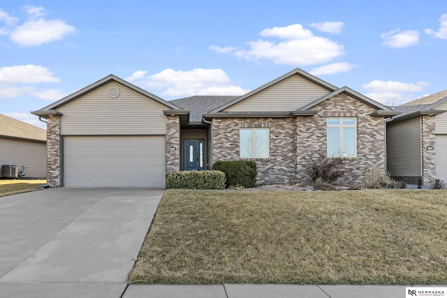 ranch-style house featuring a front yard, central AC unit, concrete driveway, and an attached garage