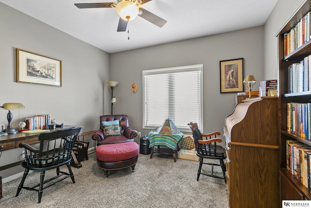 sitting room with carpet and ceiling fan