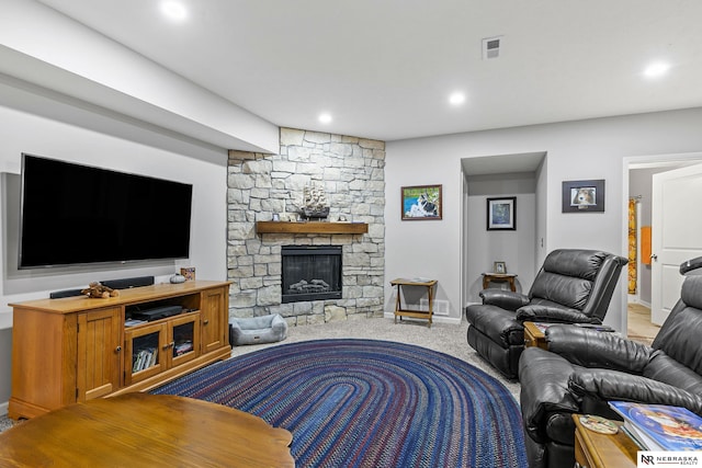 living room with visible vents, recessed lighting, a fireplace, and carpet