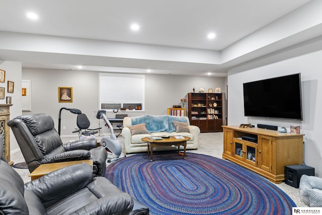 carpeted living room with recessed lighting and baseboards