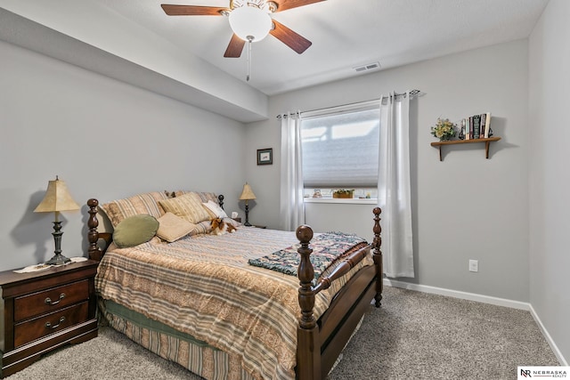 carpeted bedroom featuring visible vents, ceiling fan, and baseboards