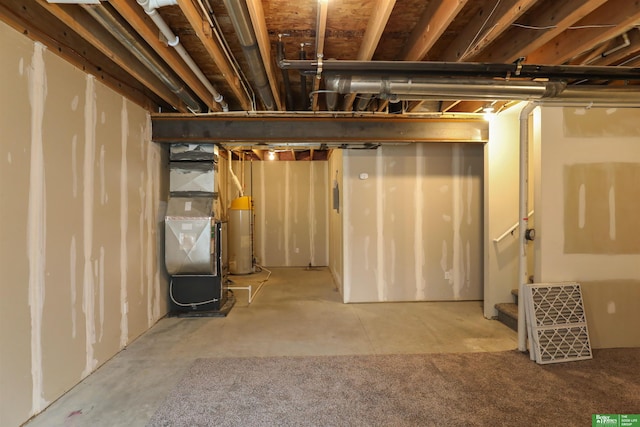 unfinished below grade area featuring gas water heater and heating unit