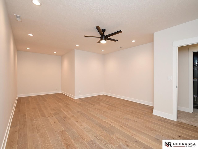 spare room with light wood-style flooring, visible vents, and recessed lighting