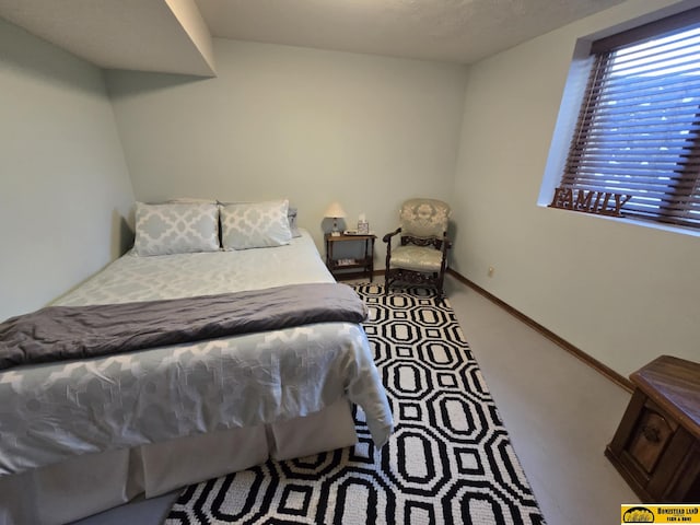 bedroom featuring carpet flooring and baseboards