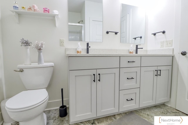 full bathroom with toilet, a shower with door, double vanity, and a sink