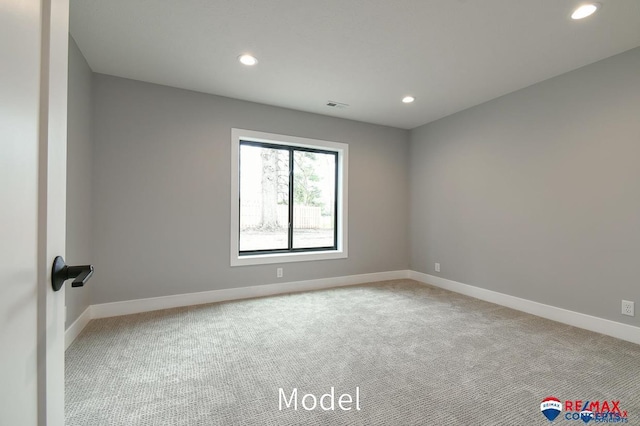 empty room with recessed lighting, carpet flooring, and baseboards