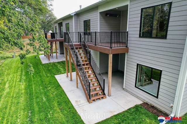 view of yard featuring a patio area, a deck, and stairs