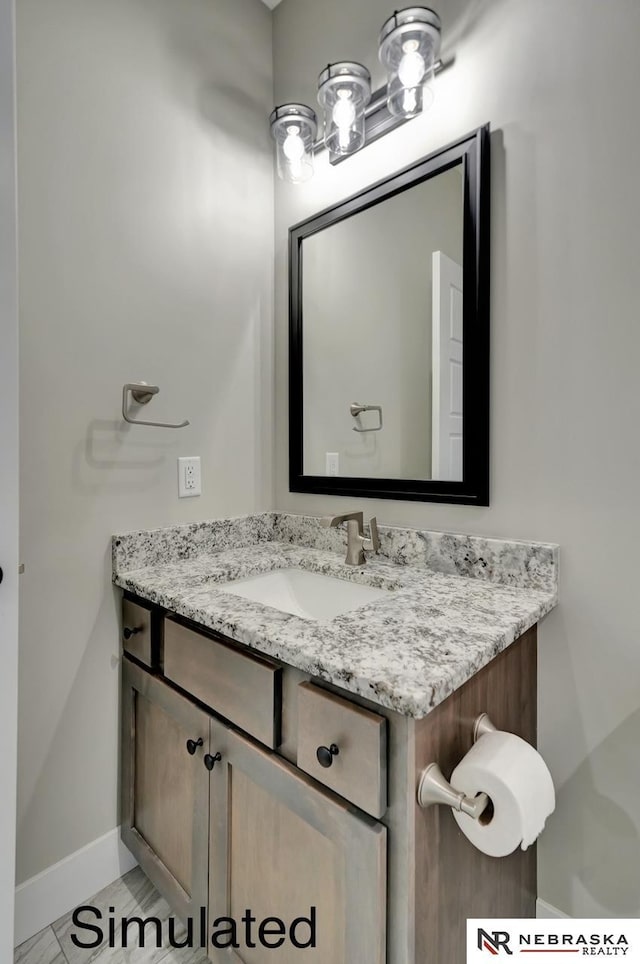 bathroom featuring vanity and baseboards