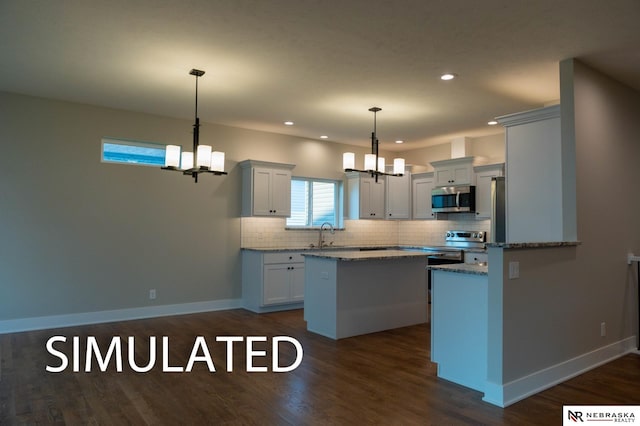 kitchen with stainless steel appliances, a notable chandelier, backsplash, and dark wood-style floors