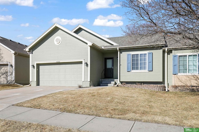 ranch-style house featuring driveway, a front lawn, and an attached garage