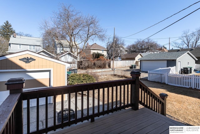 deck with fence and an outdoor structure