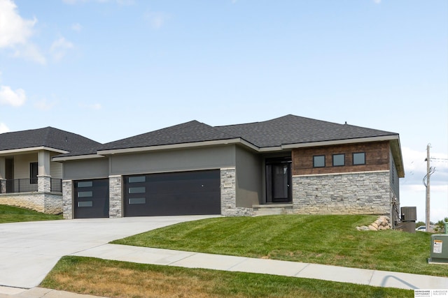 prairie-style home featuring a garage, central air condition unit, concrete driveway, and stucco siding