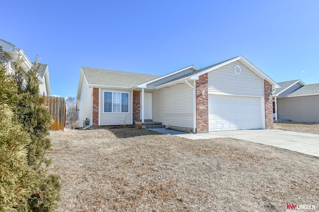 ranch-style house with concrete driveway, brick siding, fence, and an attached garage