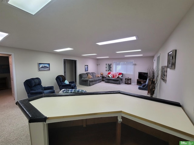 recreation room with carpet flooring