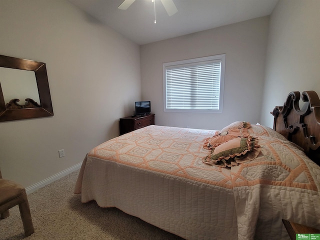 carpeted bedroom featuring a ceiling fan, lofted ceiling, and baseboards