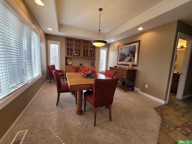 dining area with recessed lighting, a raised ceiling, visible vents, and baseboards