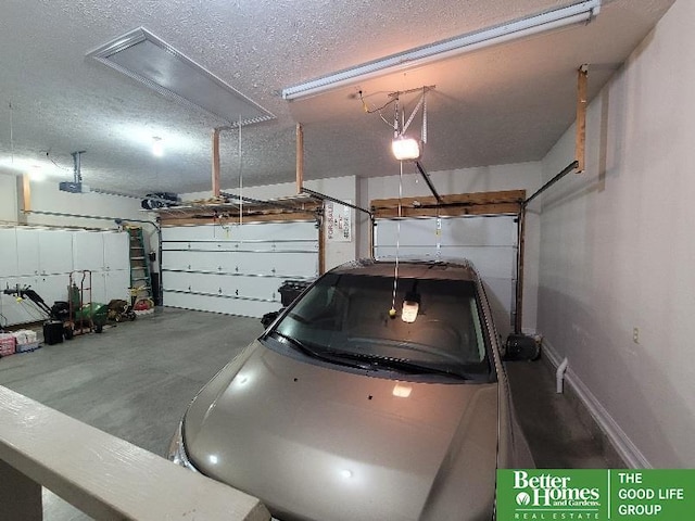 garage featuring baseboards and a garage door opener